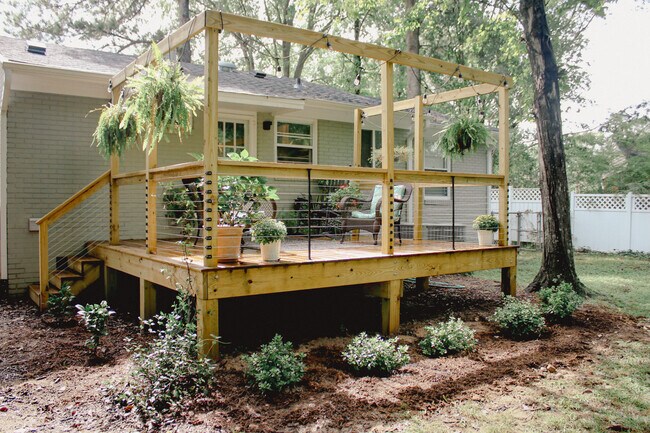 Large fenced in backyard waiting for your pup to run and play in. - 905 Culpepper Ln