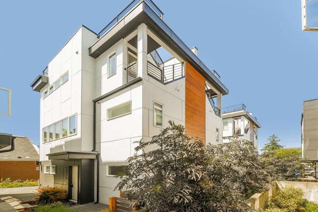 Primary Photo - Sleek 2-Bed Townhome with Rooftop Deck & A...