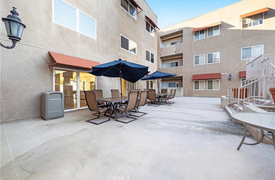 Community outdoor sitting - 9610 Zelzah Ave