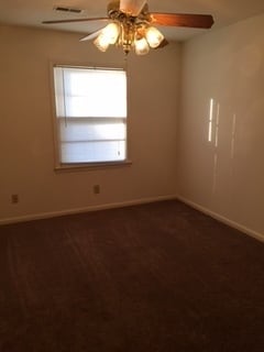 Building Photo - Brick Home with Carport & Fenced yard