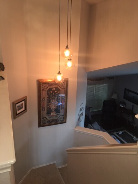 View from top of stairs, overlooking living room. - 3809 Willie Mays Ln