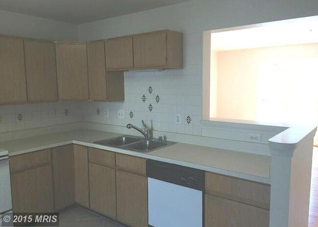 Building Photo - A spacious three bedroom, two and one half...