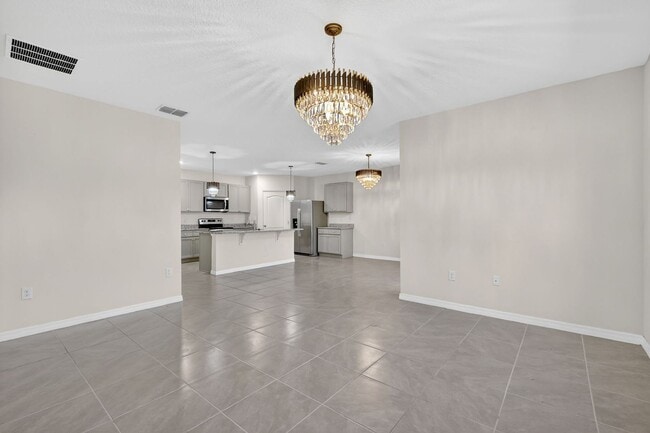 Building Photo - Available Now in Tavares | 2023 Built 4BR/2BA Home with 2-Car Garage