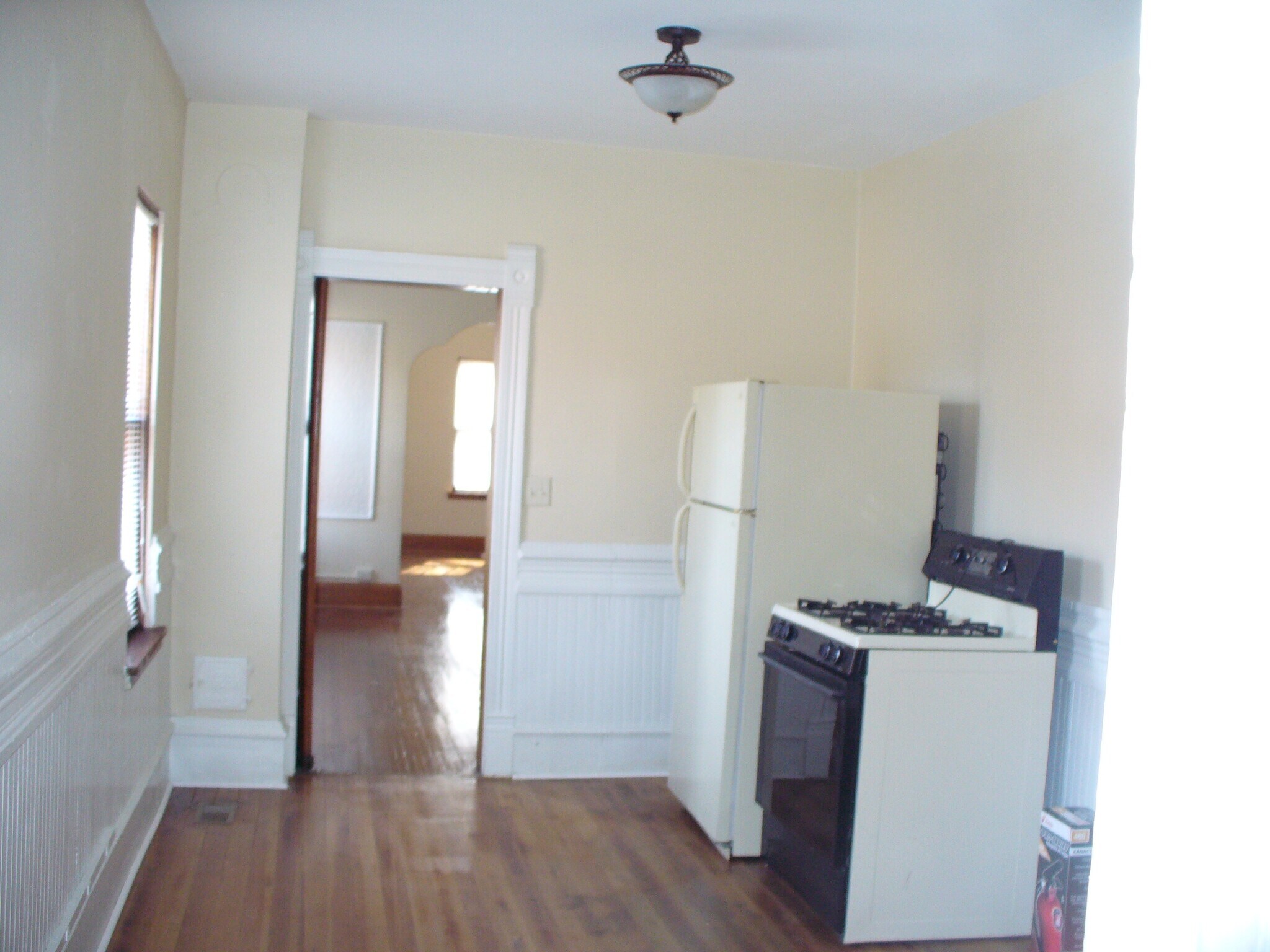 Unit 1 - Kitchen looking east to Dining room door. - 111 Main Ave W