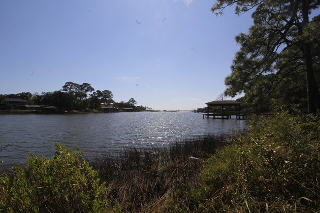 Building Photo - 2-Bedroom Waterfront Townhouse with Community Pool – Available 11/26