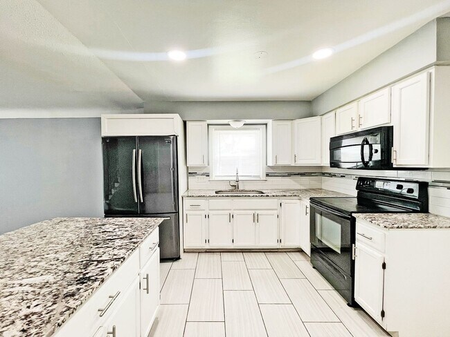 Building Photo - Beautifully Remodeled 2-Story with Huge Primary Suite, Granite Countertops, Patio, Fenced Yard & ...