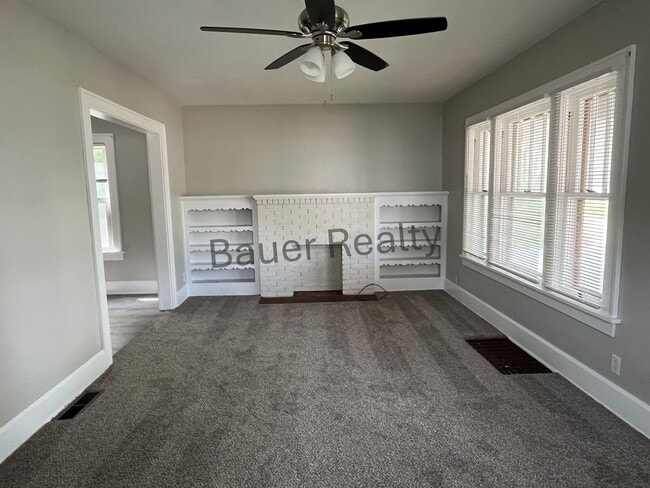 Building Photo - Three bedroom home with two car, detached garage!