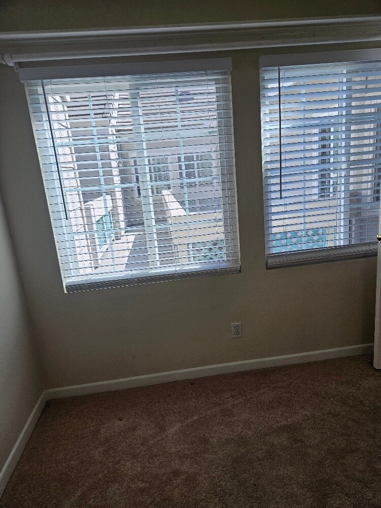 large windows in the hall bedroom - 7532 Seaspring Dr