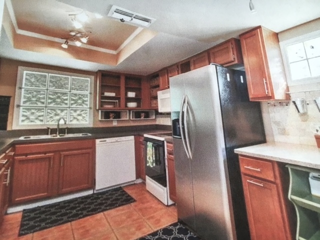 updated kitchen with garbage disposal, dishwasher, refrigerator, microwave and stove. - 2140 Redleaf Drive