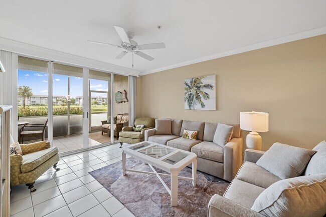 Building Photo - first-floor unit featuring a 2 bedroom, 2 bath fully furnished