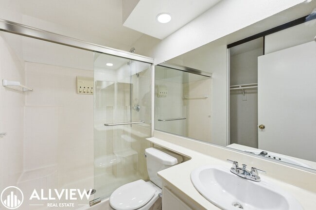 Building Photo - Fully Renovated 2 Bed Townhome with Private Patio, 2-Car Garage & Community Pool