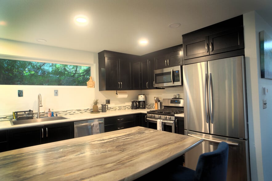 fully stocked kitchen with premium appliances and LED smart lighting - 1114 Pawnee Ln