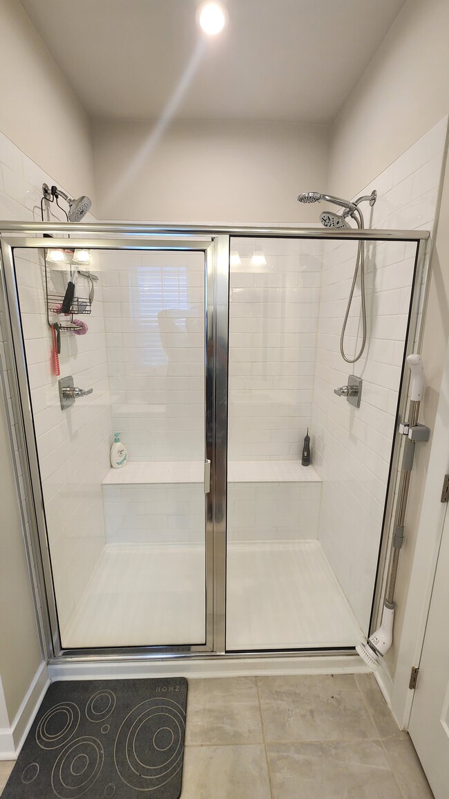 Primary bedroom shower with dual shower heads - 610 Vestrella Rd