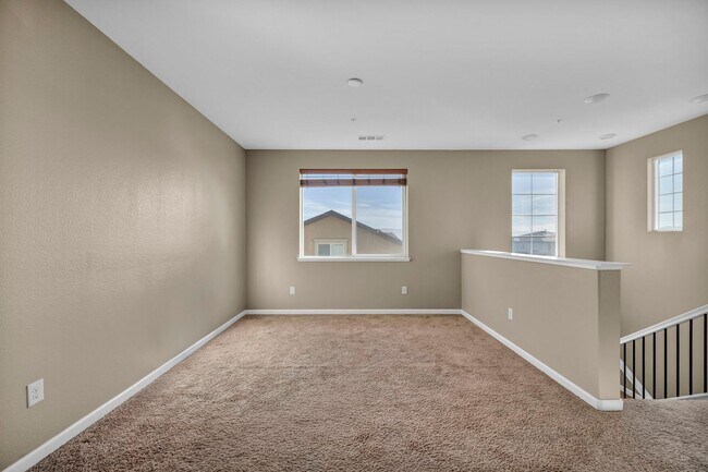 Building Photo - Sun-Filled, Spacious Living with a Three-Car Garage