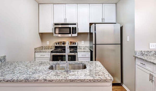 Renovated kitchens with premium finishes are available for upgrade. Ask the leasing team for more details. - Burke Shire Commons Apartments