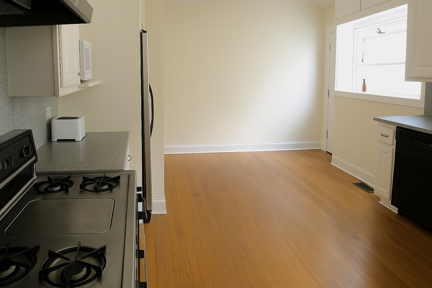 Eat-In Kitchen w Bay Window & Large L-Shaped Counter with Deep Sink & Dishwasher (Not Shown) - 325 S Berkeley Ave