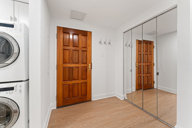 Main unit entry foyer has roomy hall mirrored closet! - 1530 Key Blvd