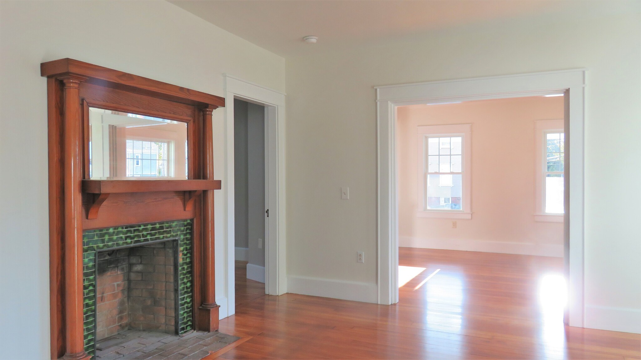 The original firelace does not work but offers a lovely room design element - 21 Courtland St