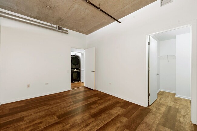 Bedroom featuring Walk-In closet - 240 E Illinois St