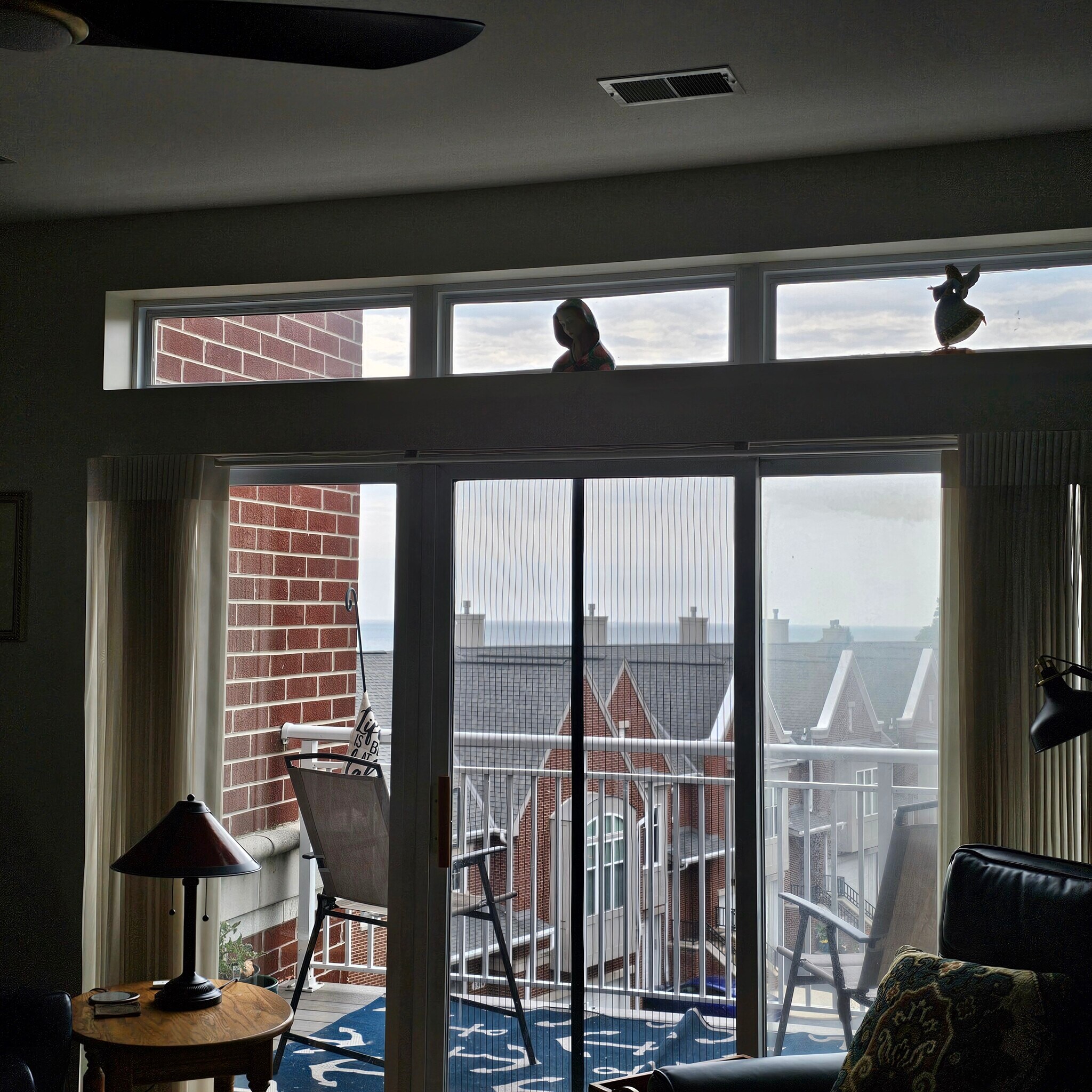 View from Living room to deck with view - 3872 S Lake Dr