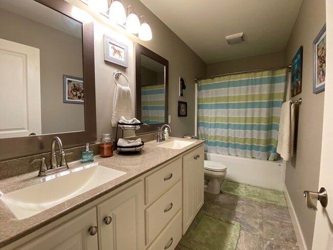 Building Photo - FENCED BACKYARD! BONUS ROOM/OFFICE! SAFE ROOM! THREE CAR GARAGE