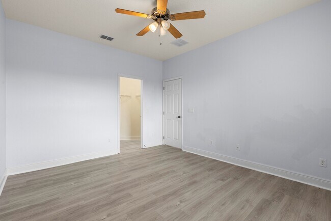 Building Photo - Spacious 6-Bedroom Home Near Lake Nona | 3-Car Garage + Tesla Charger