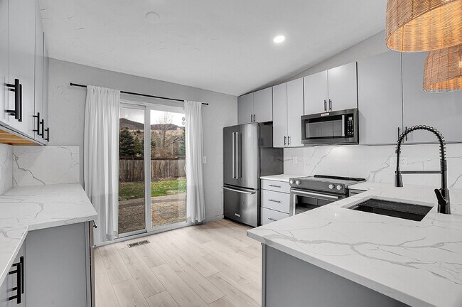 Building Photo - $3,295.95 - 3 bed, 2 bath updated Home in Littleton with Two Full Kitchens and Impressive Yard!
