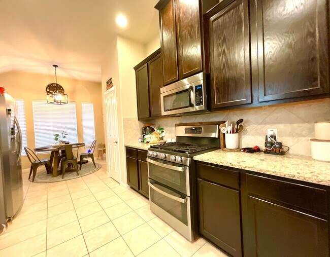 Building Photo - *COMING SOON* Modern Home with Fenced Backyard, Community Pool & Playground!