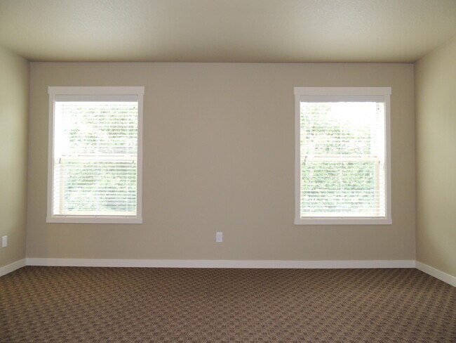 Building Photo - RENT REDUCTION; Modern Hawks Prairie Townhome