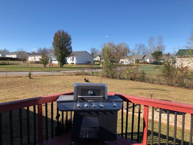Back yard with grill and fire pit-included. - 101 Bowers Ct