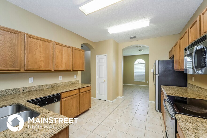 Building Photo - 5003 Boots and Saddle Ct