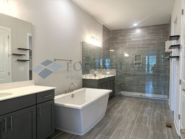 Building Photo - Elegant 4-Bed / 3.5-Bath Home with Main-Level Primary Suite, Quartz Kitchen & 3-Car Garage – In H...