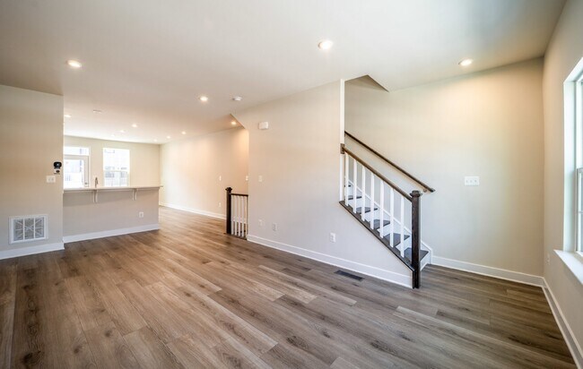 Building Photo - This 3-bedroom, 3-full bathroom townhouse offers a pristine and contemporary living experience.