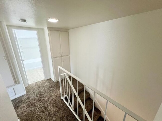 Building Photo - Stunning 4BR Townhome with Hardwood Floors, Private Patio, Community Pool & 2-Car Garage!
