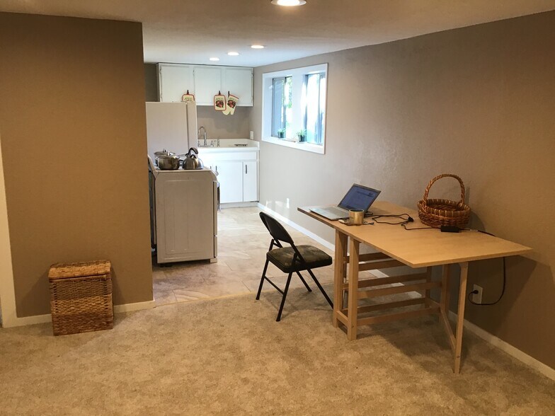Work table with kitchen view. - 17405 Ashworth Ave N
