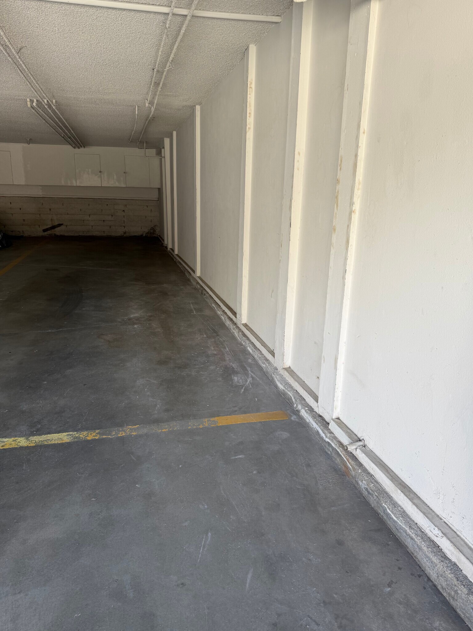 Tandem 2-car garage with storage cabinets - 700 1st St