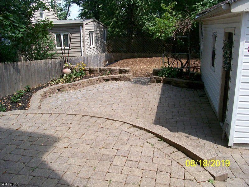 Private two-tier brick patio. Ready for summer enjoyment. - 680 Belmont Ave