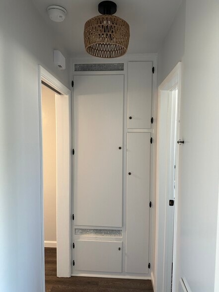 Hallway with extra storage and pocket door for privacy - 1016 Western Ave