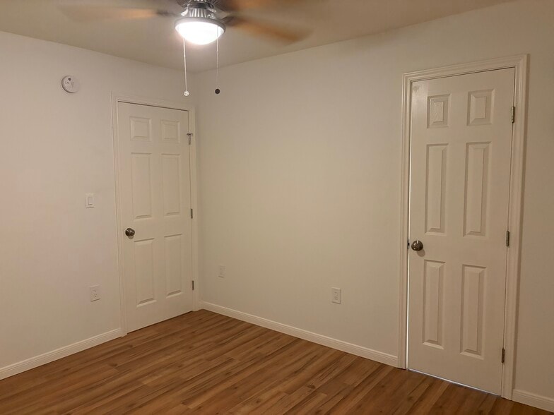 Bedroom doors to den and bathroom - 3022 Forest Ln