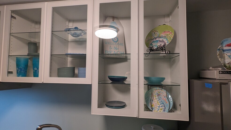 Glass shelves more light to see - 1118 Peachtree St