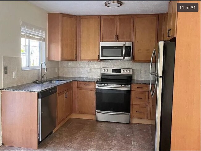 Building Photo - 2/2/1 home with a spacious fenced backyard...