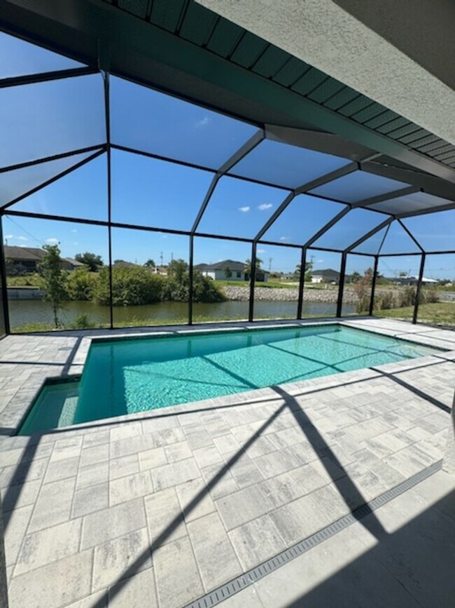 Building Photo - Move In Special! Pool Home with Canal View
