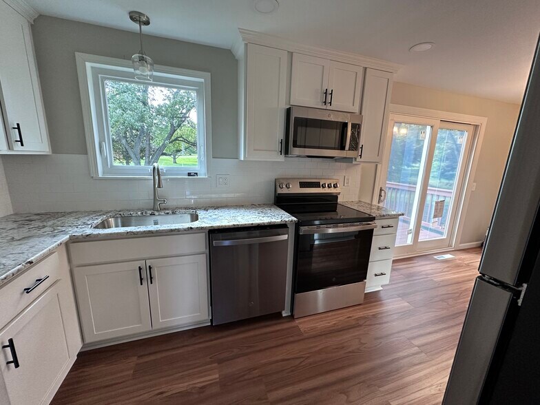 Kitchen with new stainless appliances - 2311 Baird Rd