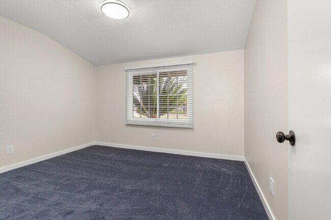 Building Photo - Charming Updated Home With Drive-Through Garage Access
