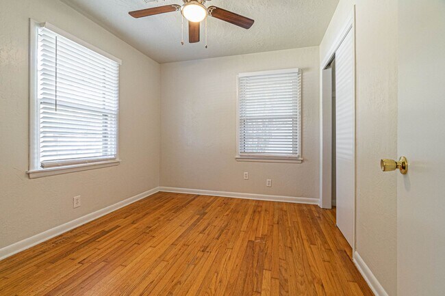Building Photo - Three Bedroom Home in tree filled neighborhood! Lawn care included!
