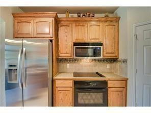 Building Photo - Former model home on corner lot is ready for move in!