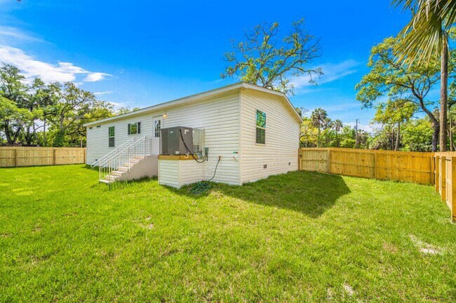 Building Photo - Experience exceptional living at its finest