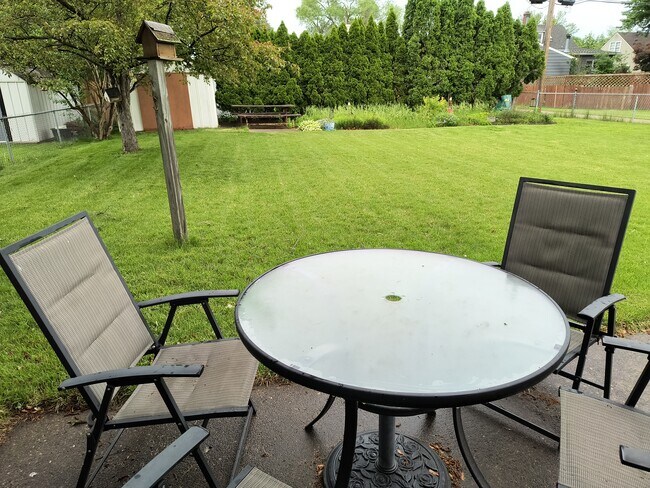 Nice patio off the three seasons room. Big fenced backyard. - 2227 23rd St S
