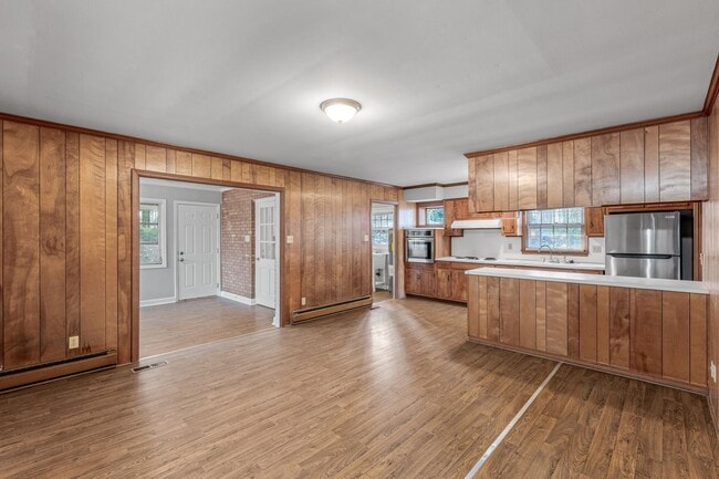 Building Photo - Large Brick Ranch, New Wood Like Flooring Throughout, Just Painted, LR, Den, Sun Room, Carport!