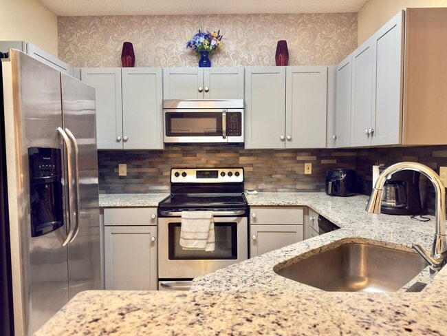 Building Photo - Turnkey and Move-in ready! Fully Furnished...